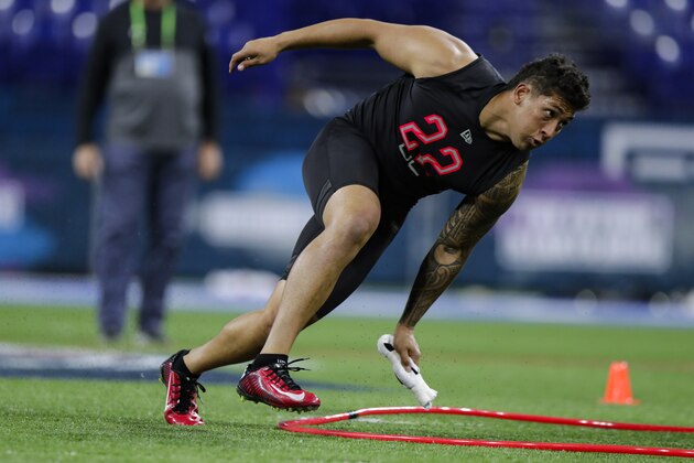 Utah defensive lineman Bradlee Anae runs a drill at the NFL football scouting combine in Indianapolis, Saturday, Feb. 29, 2020. (AP Photo/Michael Conroy)