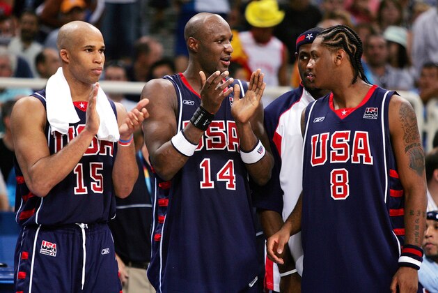 The USA's Richard Jefferson (15), Lamar Odom (14) and Carmelo Anthony (8) react at the end of a 102-94 win over Spain in their quarterfinal match at the Olympic Indoor Hall during the 2004 Olympics in Athens, Greece on Thursday, Aug. 26, 2004. (AP Photo/Dusan Vranic)