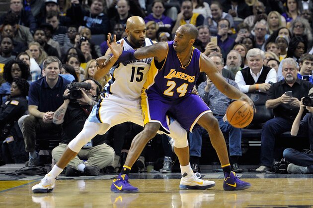 MEMPHIS, TN - FEBRUARY 24:  Kobe Bryant #24 of the Los Angeles Lakers plays against Vince Carter #15 of the Memphis Grizzlies at FedExForum on February 24, 2016 in Memphis, Tennessee. NOTE TO USER: User expressly acknowledges and agrees that, by downloading and or using this photograph, User is consenting to the terms and conditions of the Getty Images License Agreement.  (Photo by Frederick Breedon/Getty Images)