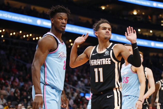 ATLANTA, GA - FEBRUARY 20: Trae Young #11 of the Atlanta Hawks reacts alongside Jimmy Butler #22 of the Miami Heat during the second half of an NBA game at State Farm Arena on February 20, 2020 in Atlanta, Georgia. NOTE TO USER: User expressly acknowledges and agrees that, by downloading and/or using this photograph, user is consenting to the terms and conditions of the Getty Images License Agreement. (Photo by Todd Kirkland/Getty Images)