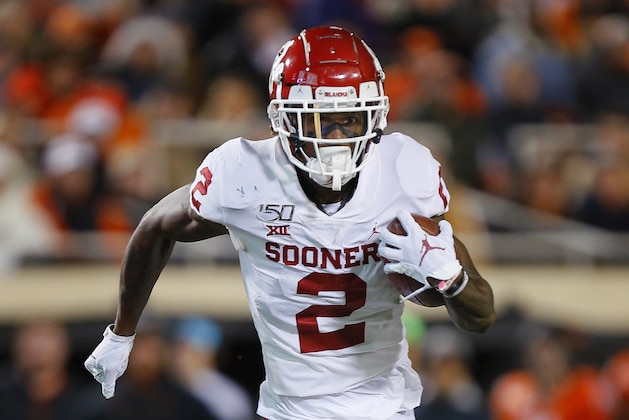 STILLWATER, OK - NOVEMBER 30:  Wide receiver CeeDee Lamb #2 of the Oklahoma Sooners runs the ball to the one-yard line against the Oklahoma State Cowboys in the fourth quarter on November 30, 2019 at Boone Pickens Stadium in Stillwater, Oklahoma.  OU won 34-16.  (Photo by Brian Bahr/Getty Images)