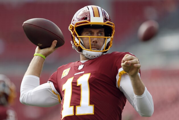 Washington Redskins quarterback Alex Smith warms up before an NFL football game against the Tampa Bay Buccaneers Sunday, Nov. 11, 2018, in Tampa, Fla. (AP Photo/Mark LoMoglio)