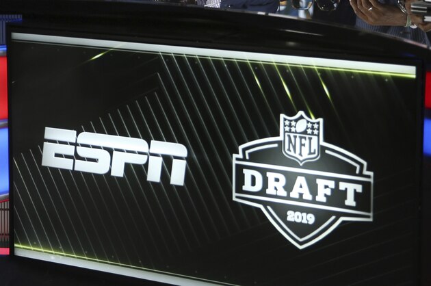 From left, Mel Kiper Jr., Booger McFarland, and Louis Riddick are seen on the set of ESPN SportsCenter, Wednesday, April 24, 2019, in Nashville, Tenn. (AP Photo/Steve Luciano)