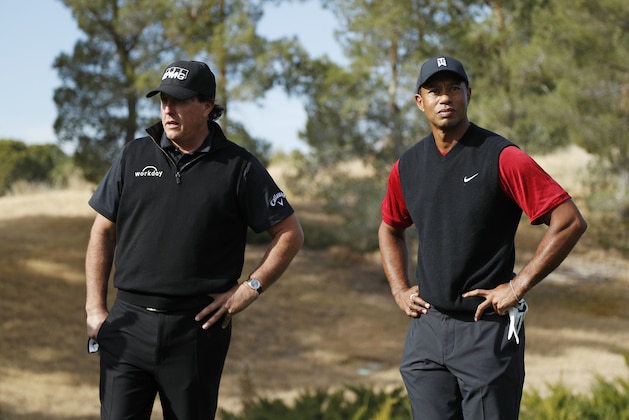 Phil Mickelson, left, and Tiger Woods stand at the first tee before a golf match at Shadow Creek golf course, Friday, Nov. 23, 2018, in Las Vegas. (AP Photo/John Locher)