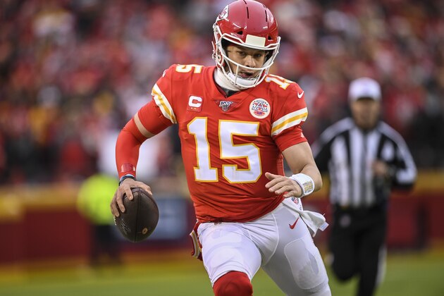Kansas City Chiefs quarterback Patrick Mahomes (15) scrambles against the Houston Texans during the first half of an NFL football game in Kansas City, Mo., Sunday, Jan. 12, 2020. (AP Photo/Reed Hoffmann)
