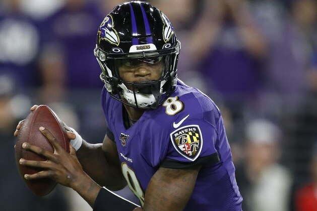 Baltimore Ravens quarterback Lamar Jackson (8) runs out of the pocket against the Tennessee Titans during the first half an NFL divisional playoff football game, Saturday, Jan. 11, 2020, in Baltimore. (AP Photo/Julio Cortez)