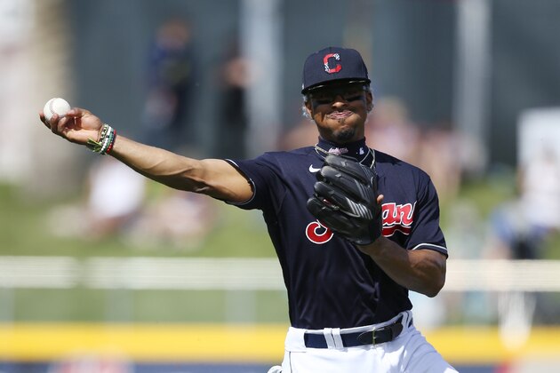 Cleveland Indians shortstop Francisco Lindor throws to first base to get Los Angeles Dodgers' Terrance Gore out during the second inning of a spring training baseball game Thursday, Feb. 27, 2020, in Goodyear, Ariz. The Dodgers won 6-5. (AP Photo/Ross D. Franklin)