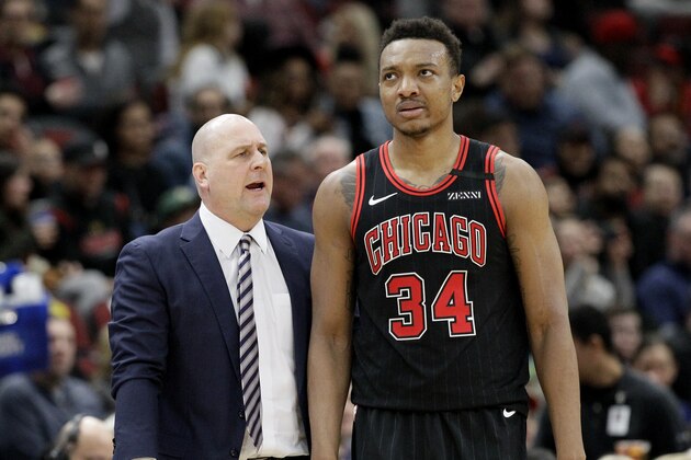 Chicago Bulls coach Jim Boylen, left, talks with center Wendell Carter Jr. during the second half of the team's NBA basketball game against the Indiana Pacers in Chicago, Friday, March 6, 2020. The Pacers won 108-102. (AP Photo/Nam Y. Huh)