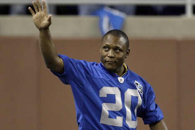 Former Detroit Lions running back Barry Sanders waves to the crowd as the Detroit Lions 75th season all-time team was introduced at halftime of the Jacksonville Jaguars-Detroit Lions NFL football game in Detroit, Sunday, Nov. 9, 2008. (AP Photo/Paul Sancya)