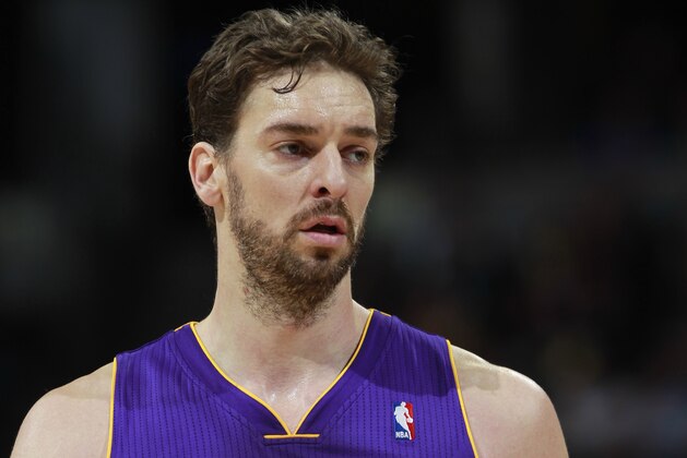 Los Angeles Lakers center Pau Gasol, of Spain, looks on against the Denver Nuggets in the third quarter of the Nuggets' 134-126 victory in an NBA basketball game in Denver on Friday, March 7, 2014. (AP Photo/David Zalubowski)