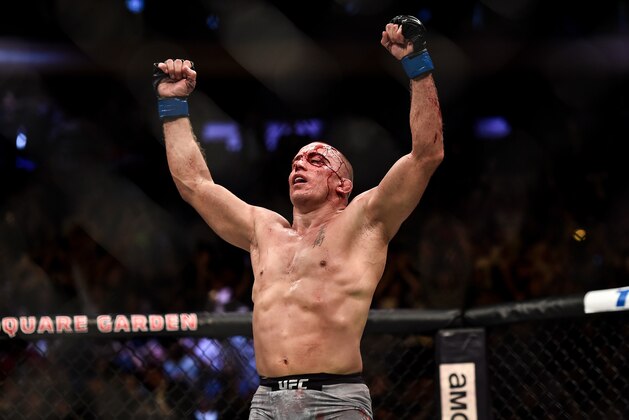 NEW YORK, NY - NOVEMBER 04:  Georges St-Pierre of Canada celebrates his submission victory over Michael Bisping of England in their UFC middleweight championship bout during the UFC 217 event inside Madison Square Garden on November 4, 2017 in New York City. (Photo by Brandon Magnus/Zuffa LLC/Zuffa LLC via Getty Images)