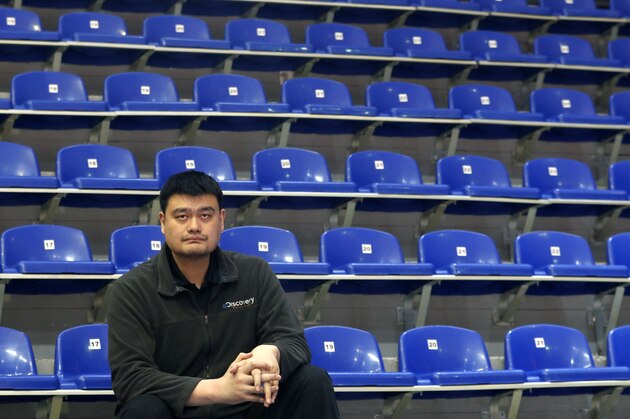 Yao Ming, head of the Chinese Basketball Association and former NBA player looks on during warm up before the Women's Olympic Qualifying Tournaments match between Korea and China in Belgrade, Serbia, Sunday, Feb. 9, 2020. (AP Photo/Darko Vojinovic)
