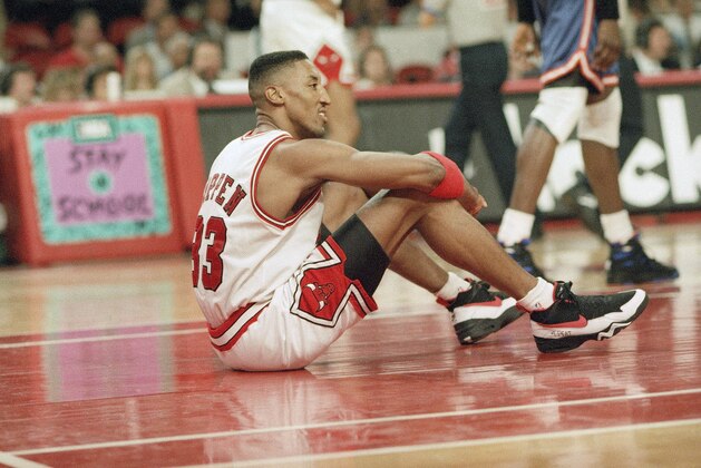 The Chicago Bulls' Scottie Pippen sits on the floor during a break in the action of the third quarter of the Semifinal Playoff Game with the New York Knicks in Chicago, Friday, May 13, 1994. Questions are being asked after Pippen sat on the bench as the Bulls beat the Knicks 104-102, on Toni Kukoc's last second shot. (AP Photo/John Swart)
