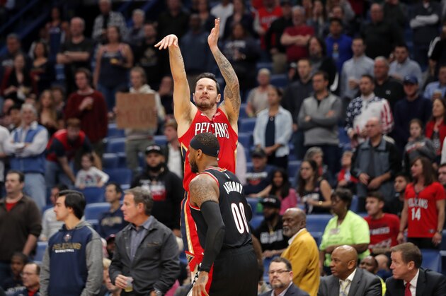 New Orleans Pelicans guard JJ Redick shoots over Portland Trail Blazers forward Carmelo Anthony (00) in the first half of an NBA basketball game in New Orleans, Tuesday, Nov. 19, 2019. (AP Photo/Gerald Herbert)