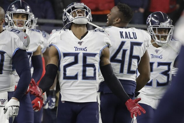 Tennessee Titans cornerback Logan Ryan celebrates his interception for a touchdown against the New England Patriots in the second half of an NFL wild-card playoff football game, Saturday, Jan. 4, 2020, in Foxborough, Mass. (AP Photo/Steven Senne)