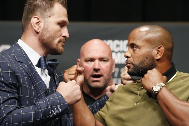Stipe Miocic, left, and Daniel Cormier pose during a news conference for UFC 226, Thursday, July 5, 2018, in Las Vegas. The two are scheduled to fight in a heavyweight title fight Saturday in Las Vegas. (AP Photo/John Locher)