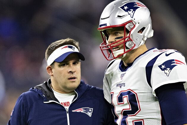 HOUSTON, TX - DECEMBER 1:  Offensive Coordinator Josh McDaniels talks with Tom Brady #12 of the New England Patriots before a game against the Houston Texans at NRG Stadium on December 1, 2019 in Houston, Texas.  The Texans defeated the Patriots 28-22.  (Photo by Wesley Hitt/Getty Images)
