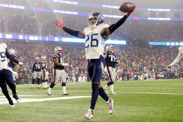 FOXBOROUGH, MASSACHUSETTS - JANUARY 04: Logan Ryan #26 of the Tennessee Titans scores a touchdown against the New England Patriots in the fourth quarter of the AFC Wild Card Playoff game at Gillette Stadium on January 04, 2020 in Foxborough, Massachusetts. (Photo by Kathryn Riley/Getty Images)