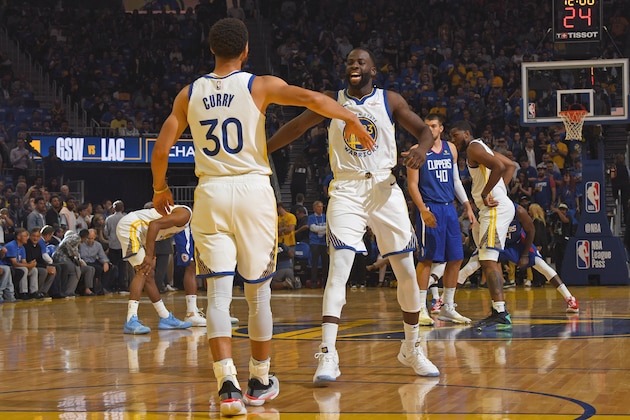 SAN FRANCISCO, CA - OCTOBER 24: Stephen Curry #30 and Draymond Green #23 of the Golden State Warriors high five before tip off against the LA Clippers on October 24, 2019 at Chase Center in San Francisco, California. NOTE TO USER: User expressly acknowledges and agrees that, by downloading and/or using this Photograph, user is consenting to the terms and conditions of the Getty Images License Agreement. Mandatory Copyright Notice: Copyright 2019 NBAE (Photo by Andrew D. Bernstein/NBAE via Getty Images)