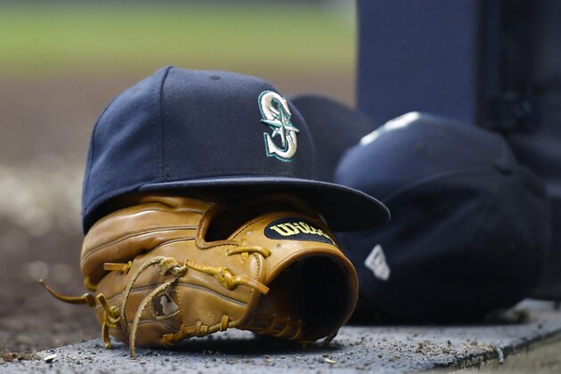 MILWAUKEE, WISCONSIN - JUNE 26: A general view of a Seattle Mariners hat and a baseball glove during the game against the Milwaukee Brewers at Miller Park on June 26, 2019 in Milwaukee, Wisconsin. (Photo by Quinn Harris/Getty Images)