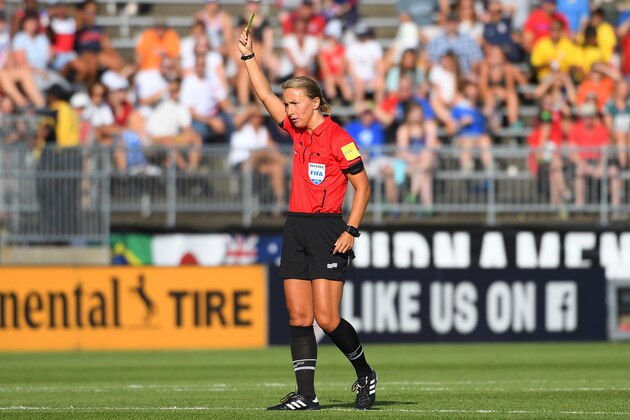 EAST HARTFORD, CT - JULY 29:  Referee Katja Koroleva of the United States issues a yellow card to Daiane (not pictured) of Brazil against Japan during the second half of a Tournament of Nations game played at Pratt & Whitney Stadium on July 29, 2018 in East Hartford, Connecticut. Brazil defeated Japan 2-1. (Photo by Rich Barnes/Getty Images)