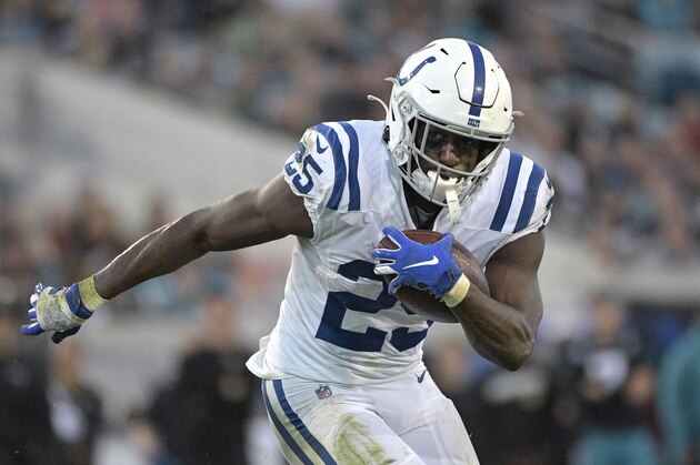 Indianapolis Colts running back Marlon Mack (25) rushes for an 8-yard touchdown during the first half of an NFL football game against the Jacksonville Jaguars Sunday, Dec. 29, 2019, in Jacksonville, Fla. (AP Photo/Phelan M. Ebenhack)
