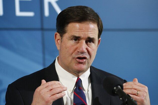 Arizona Republican Gov. Doug Ducey speaks at a news conference regarding the latest updates on the coronavirus Monday, May 4, 2020, in Phoenix. (AP Photo/Ross D. Franklin, Pool)