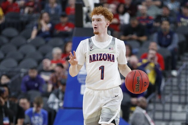 Arizona's Nico Mannion (1) plays against Washington during an NCAA college basketball game in the first round of the Pac-12 men's tournament Wednesday, March 11, 2020, in Las Vegas. (AP Photo/John Locher)