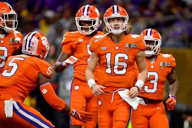 NEW ORLEANS, LOUISIANA - JANUARY 13: K.J. Henry #5, left, congratulates Trevor Lawrence #16, Amari Rodgers #3, rear, after Tee Higgins #5 of the Clemson Tigers 36-yard touchdown run during the second quarter of the College Football Playoff National Championship game against the LSU Tigers at the Mercedes Benz Superdome on January 13, 2020 in New Orleans, Louisiana. The LSU Tigers topped the Clemson Tigers, 42-25. (Photo by Alika Jenner/Getty Images)