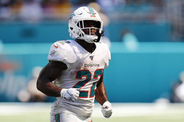 Miami Dolphins running back Mark Walton (22) runs back to his position, during the first half at an NFL football game against the Washington Redskins, Sunday, Oct. 13, 2019, in Miami Gardens, Fla. (AP Photo/Brynn Anderson)