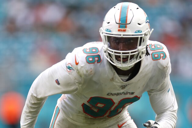 Miami Dolphins defensive end Taco Charlton (96) rushes in against the New York Jets during an NFL football game, Sunday, Nov. 3, 2019, in Miami Gardens, Fla. The Dolphins won 26-18. (Jeff Haynes/AP Images for Panini)
