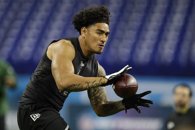 UCLA tight end Devin Asiasi runs a drill at the NFL football scouting combine in Indianapolis, Thursday, Feb. 27, 2020. (AP Photo/Michael Conroy)