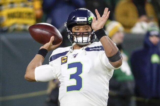 Seattle Seahawks quarterback Russell Wilson warms up before an NFL divisional playoff football game against the Green Bay Packers Sunday, Jan. 12, 2020, in Green Bay, Wis. (AP Photo/Matt Ludtke)