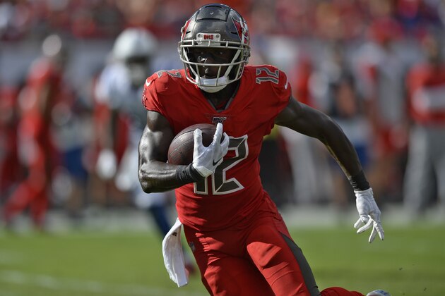 Tampa Bay Buccaneers wide receiver Chris Godwin (12) runs with the football after a reception against the Indianapolis Colts during the first half of an NFL football game Sunday, Dec. 8, 2019, in Tampa, Fla. (AP Photo/Jason Behnken)