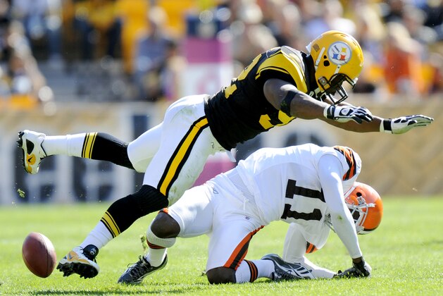 FILE - In this Oct. 17, 2010, file photo, Pittsburgh Steelers linebacker James Harrison (92) hits Cleveland Browns wide receiver Mohamed Massaquoi (11) during the second quarter of a an NFL football game in Pittsburgh.  Harrison was fined $75,000 on Tuesday, Oct. 19, 2010, for his hit against Massaquoi. (AP Photo/Don Wright, File)