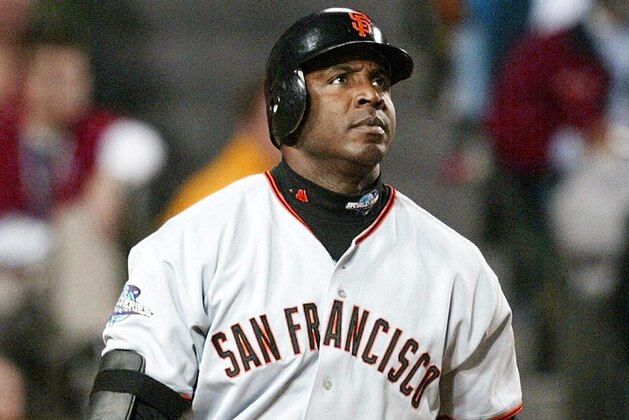 San Francisco Giants slugger Barry Bonds watches the ball after hitting a solo run homerun against the Anaheim Angels in the sixth inning of Game 6 of the World Series in Anaheim, CA, 26 October, 2002. The Giants are leading the best-of-seven series 3-2.  AFP PHOTO/Jeff HAYNES (Photo by JEFF HAYNES / AFP)        (Photo credit should read JEFF HAYNES/AFP via Getty Images)