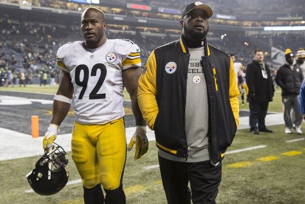 SEATTLE, WA - NOVEMBER 29: Linebacker James Harrison #92 of the Pittsburgh Steelers and head coach Mike Tomlin walk off the field after a football game against the Seattle Seahawks at CenturyLink Field on November 29, 2015 in Seattle, Washington. The Seahawks won the game 39-30. (Photo by Stephen Brashear/Getty Images)