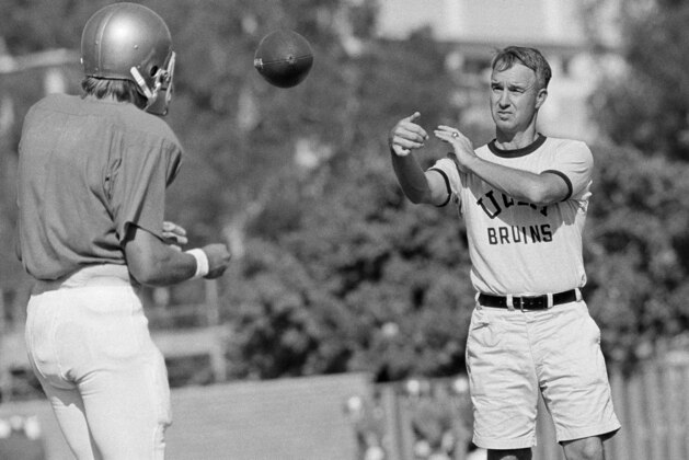 UCLA quarterback Mark Harmon son of former Michigan Heisman Trophy winner Tom Harmon, works out with Coach Pepper Rodgers on Tuesday, Sept. 13, 1972 in Los Angeles. After UCLA?s upset win over Nebraska lat week, Rodgers said ?Mark Harmon?s opening-game performance was better then that of the other quarterbacks I?ve had.? (AP Photo/GB)