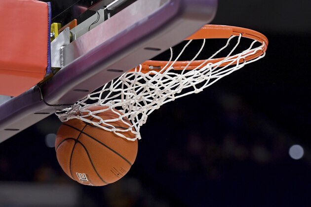 Basketball through the hoop in the first half of an NCAA college basketball game, Tuesday, Feb. 18, 2020, in Baton Rouge, La. (AP Photo/Bill Feig)