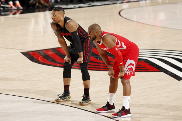 PORTLAND, OR - MARCH 20: Damian Lillard #0 of the Portland Trail Blazers and Chris Paul #3 of the Houston Rockets looks on during the game on March 20, 2018 at the Moda Center in Portland, Oregon. NOTE TO USER: User expressly acknowledges and agrees that, by downloading and or using this Photograph, user is consenting to the terms and conditions of the Getty Images License Agreement. Mandatory Copyright Notice: Copyright 2018 NBAE (Photo by Cameron Browne/NBAE via Getty Images)