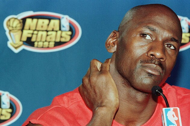 CHICAGO, UNITED STATES: Michael Jordan of the Chicago Bulls listens to a question addressed to him about his future 11 June during a press conference after practice for Game Five of the NBA Finals against the Utah Jazz at the United Center in Chicago, IL. Jordan has lead the Bulls to a lead in the best-of- seven series three games to one. AFP PHOTO/Jeff HAYNES (Photo credit should read JEFF HAYNES/AFP via Getty Images) CHICAGO, UNITED STATES: Michael Jordan of the Chicago Bulls listens to a question addressed to him about his future 11 June during a press conference after practice for Game Five of the NBA Finals against the Utah Jazz at the United Center in Chicago, IL. Jordan has lead the Bulls to a lead in the best-of- seven series three games to one. AFP PHOTO/Jeff HAYNES (Photo credit should read JEFF HAYNES/AFP via Getty Images)