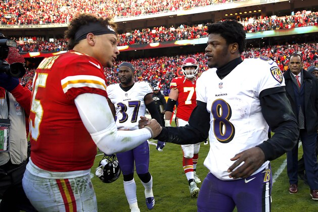 KANSAS CITY, MISSOURI - DECEMBER 09:  Quarterback Patrick Mahomes #15 of the Kansas City Chiefs shakes hands with quarterback Lamar Jackson #8 of the Baltimore Ravens after the Chiefs defeated the Ravens 27-24 in overtime to win the game at Arrowhead Stadium on December 09, 2018 in Kansas City, Missouri. (Photo by Jamie Squire/Getty Images)
