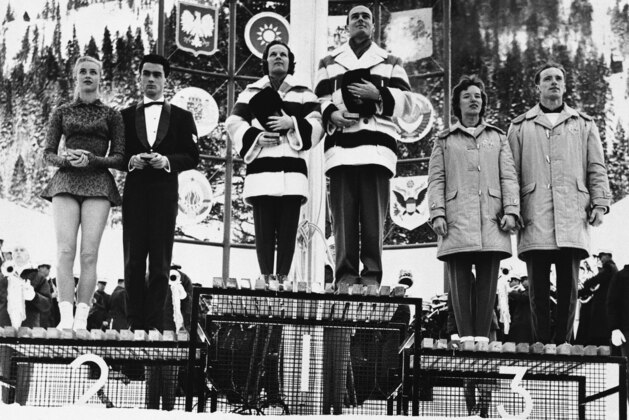 Three pairs of figure skaters who won medals in Winter Olympic competition stand on the victory platform at Squaw Valley, Calif., Feb. 19, 1969. Left to right: Marika Kilius and Hans Baumler, Germany, silver medal; Barbara Wagner and Robert Paul of Canada, gold medal; Nancy and Ronald Ludington, U.S.A., bronze medal. (AP Photo/Dick Strobel)