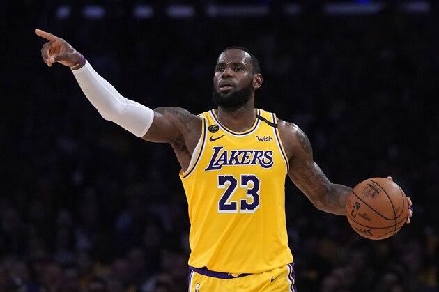 Los Angeles Lakers forward LeBron James gestures to teammates during the second half of an NBA basketball game against the Milwaukee Bucks Friday, March 6, 2020, in Los Angeles. (AP Photo/Mark J. Terrill) Los Angeles Lakers forward LeBron James gestures to teammates during the second half of an NBA basketball game against the Milwaukee Bucks Friday, March 6, 2020, in Los Angeles. (AP Photo/Mark J. Terrill)