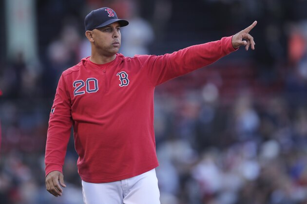 Boston Red Sox manager Alex Cora gestures toward the outfield after a win over the San Francisco Giants in a baseball game at Fenway Park in Boston, Thursday, Sept. 19, 2019. (AP Photo/Charles Krupa)
