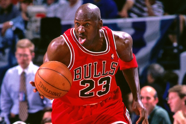 CHARLOTTE, NC - MAY 8:  Michael Jordan #23 of the Chicago Bulls handles the ball against the Charlotte Hornets on May 8, 1998 at Charlotte Coliseum in Charlotte, North Carolina. NOTE TO USER: User expressly acknowledges and agrees that, by downloading and or using this photograph, User is consenting to the terms and conditions of the Getty Images License Agreement.  Mandatory Copyright Notice:  Copyright 1998 NBAE (Photo by Kent Smith/NBAE via Getty Images)
