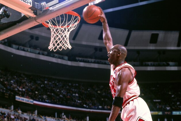 CHICAGO, IL - MAY 3:  Michael Jordan #23 of the Chicago Bulls dunks the ball against the Charlotte Hornets on May 3, 1998 at the United Center in Chicago, Illinois. NOTE TO USER: User expressly acknowledges and agrees that, by downloading and or using this photograph, user is consenting to the terms and conditions of the Getty Images License Agreement.  Mandatory Copyright Notice: Copyright 1998 NBAE (Photo by Scott Cunningham/NBAE via Getty Images)