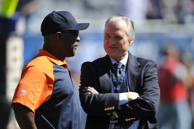Chicago Bears head coach Lovie Smith, left, talks with Mike McCaskey, former chairman of the Chicago Bears before an NFL football game against the Detroit Lions in Chicago, Sunday, Sept. 12, 2010. (AP Photo/Jim Prisching)