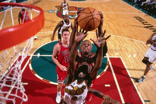 SEATTLE, WA - NOVEMBER 25: Dennis Rodman #91 of the Chicago Bulls shoots the ball during the game against the Seattle SuperSonics on November 25, 1997 at the KeyArena in Seattle, Washington. NOTE TO USER: User expressly acknowledges and agrees that, by downloading and or using this Photograph, user is consenting to the terms and conditions of the Getty Images License Agreement. Mandatory Copyright Notice: Copyright 1997 NBAE (Photo by Andrew D. Bernstein/NBAE via Getty Images)