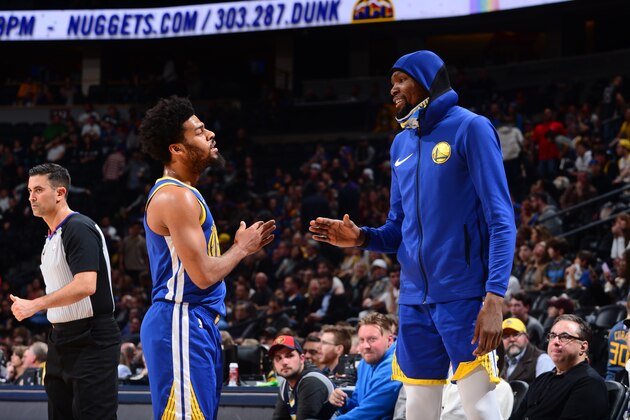 DENVER, CO - JANUARY 15: Quinn Cook #4 speaks with Kevin Durant #35 of the Golden State Warriors on January 15, 2019 at the Pepsi Center in Denver, Colorado. NOTE TO USER: User expressly acknowledges and agrees that, by downloading and/or using this Photograph, user is consenting to the terms and conditions of the Getty Images License Agreement. Mandatory Copyright Notice: Copyright 2019 NBAE (Photo by Bart Young/NBAE via Getty Images)